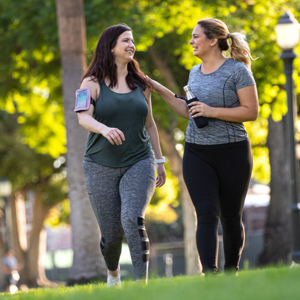 Young woman walking in the park while taking Semaglutide & Tirzepatide to help them lose weight. | Shady Grove Pharmacy